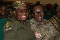 Botswana Defence Force Lance Cpl. Malebogo Mojaeti, an aircraft mechanic, and U.S. Air Force Senior Master Sgt. Jerri Edwards, bilateral affairs noncommissioned officer at U.S. Embassy Gaborone, during the opening ceremony of exercise Southern Accord 2024 in Gaborone, Botswana, Aug. 5, 2024. The biannual joint exercise is sponsored by U.S. Africa Command and led by U.S. Army Southern European Task Force, Africa.