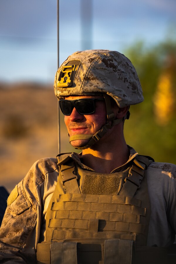 U.S. Marine Corps Lance Cpl. Michael Peters, a Louisville, Kentucky native and small unarmed aircraft systems operator with 1st Battalion, 2d Marine Regiment, 2d Marine Division, poses for a photo following a movement to contact range as a part of Service Level Training Exercise (SLTE) 5-24 at Marine Corps Air-Ground Combat Center, Twentynine Palms, California, Aug. 2, 2024. The purpose of SLTE 5-24 is to create a challenging, realistic training environment that produces combat-ready forces capable of operating as an integrated Marine Air Ground Task Force. (U.S. Marine Corps photo by Cpl. Alexis Sanchez)
