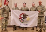 Brig. Gen. Justin Osberg presented the Soldiers of Logistics Advisor Team 6620 with an Illinois State Flag to carry with them on the team's deployment to Africa.