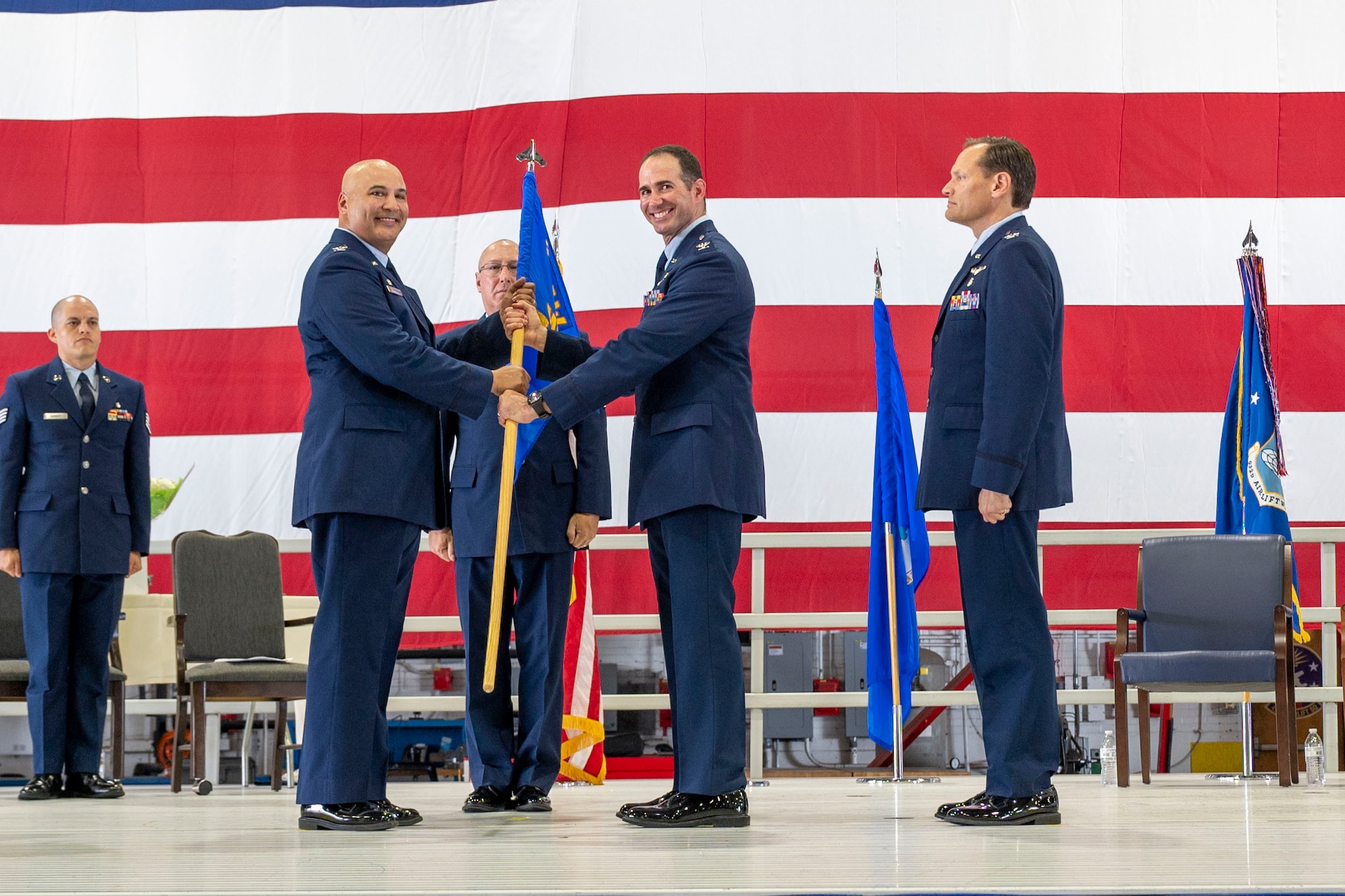 During the 932nd Airlift Wing August unit training assembly, Col. Christopher Spinelli, outgoing 932nd Medical group commander, relinquished command to Col. Robert Garner, incoming 932nd MDG commander. Col. Jeffery Smith, 932nd AW commander, presented Garner with the 932nd MDG guidon during the Change of Command ceremony held Aug. 3rd, 2024 at Hangar 1, Scott Air Force Base, Illinois. (U.S. Air Force Photo by SSgt Brooke Spenner)