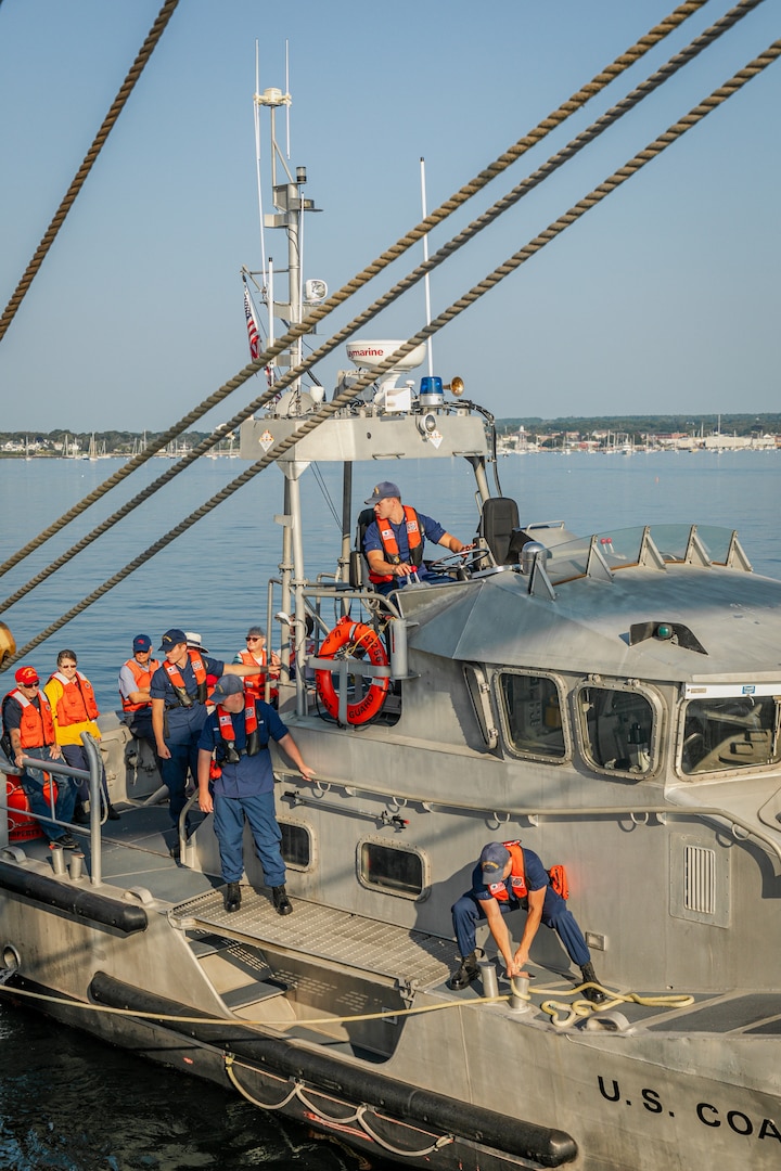 U.S. Coast Guard Station Rockland crewmembers conduct a personnel transfer to Coast Guard Cutter Eagle (WIX 327) in Rockland, Maine, Aug. 3, 2024. Eagle, the Coast Guard's First District and Station Rockland celebrated Rockland recertifying as a Coast Guard City. (U.S. Coast Guard photo by Petty Officer 2nd Class Trever Hammack)