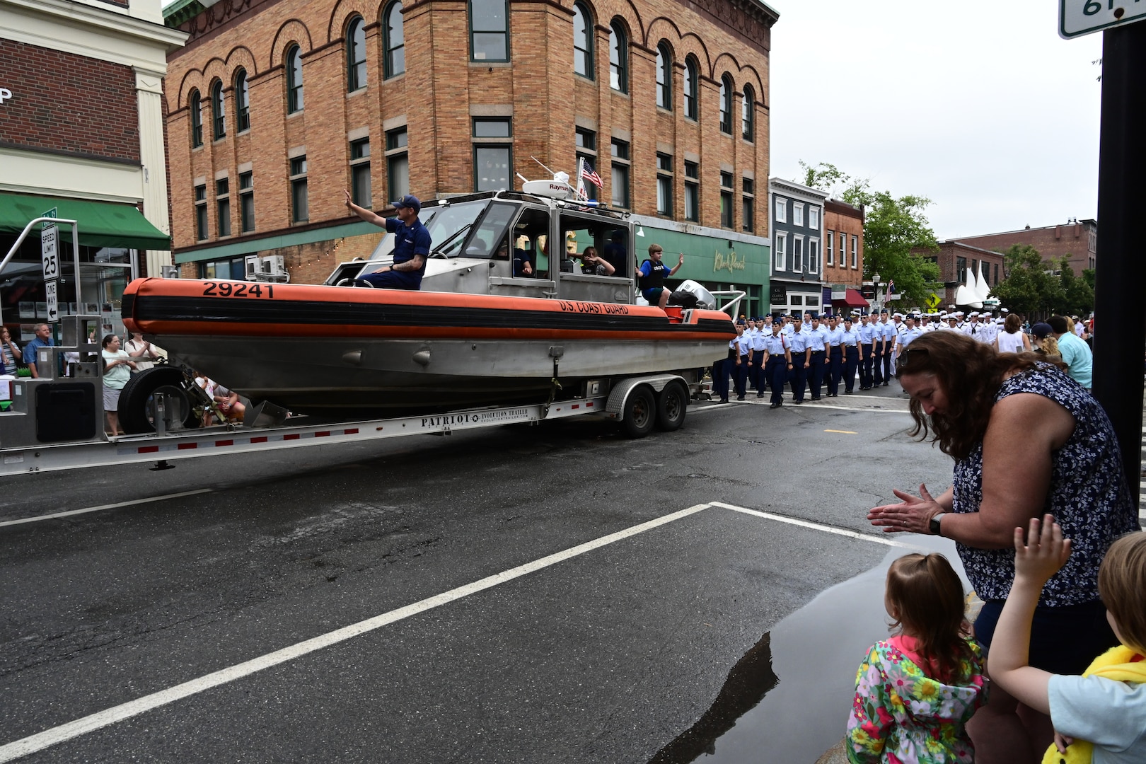 Coast Guard members from the U.S. Coast Guard Cutter Eagle (WIX 327), Coast Guard Station Rockland and Coast Guard Academy cadets march in a parade for the Maine Lobster Festival in Rockland, Maine, August 3, 2024. The Academy Cadets were embarked on Eagle for a week of at-sea training.