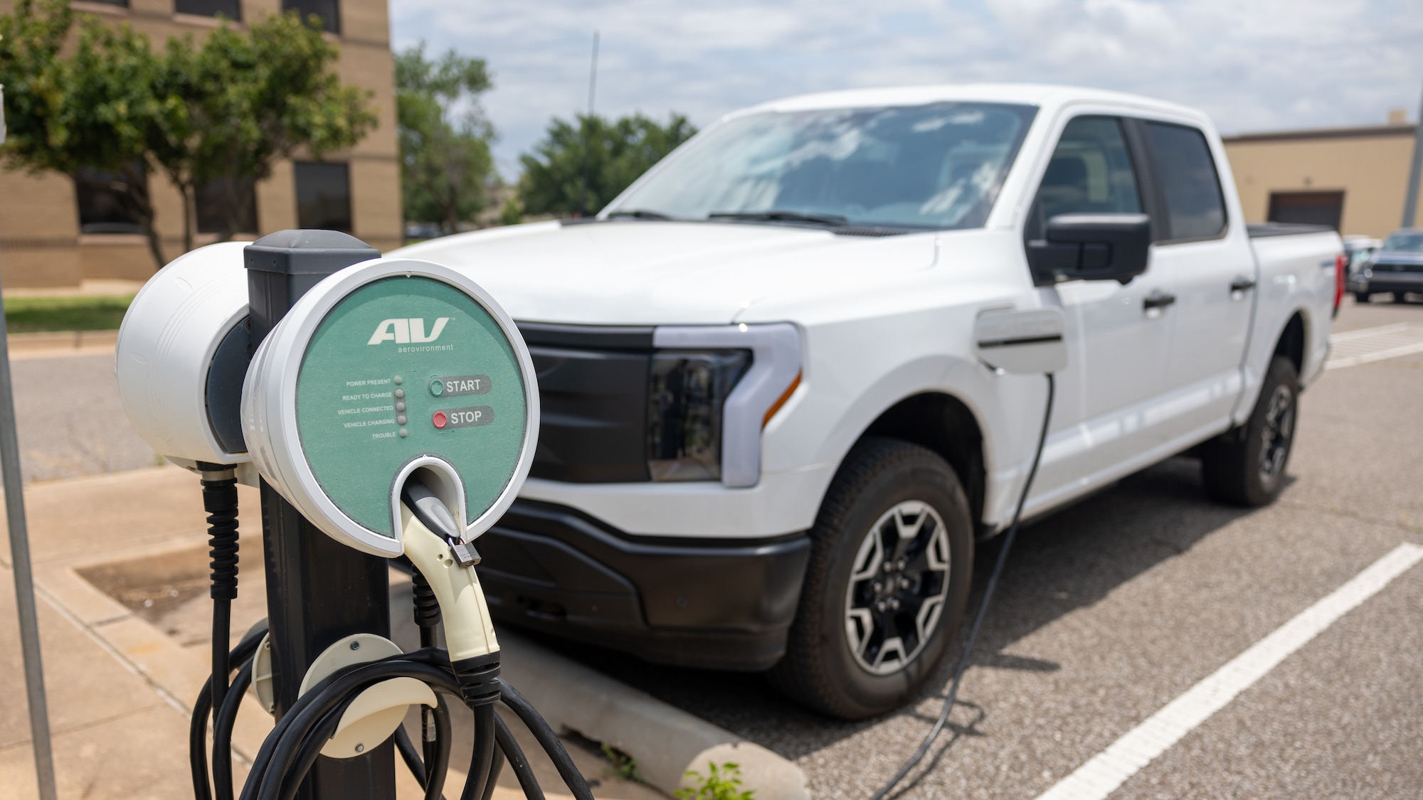 electric truck in front of charger