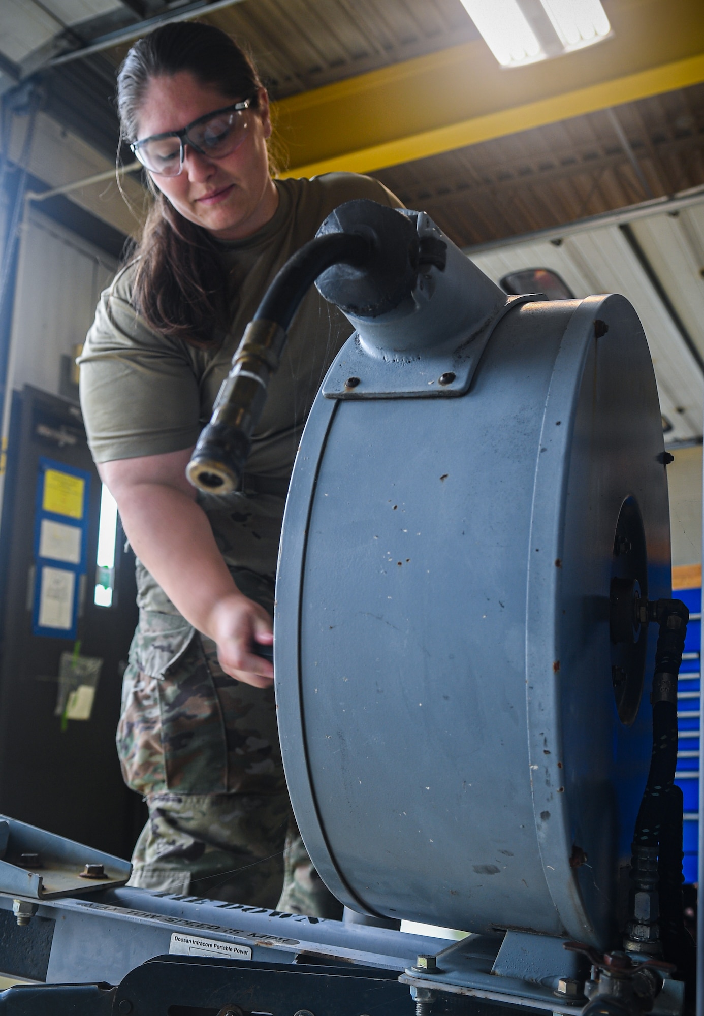 An Airman assigned to the 193rd Special Operations Maintenance Squadron Aerospace Ground Equipment section performs an annual periodic inspection on an air compressor Aug. 7, 2024 in Middletown, Pennsylvania.