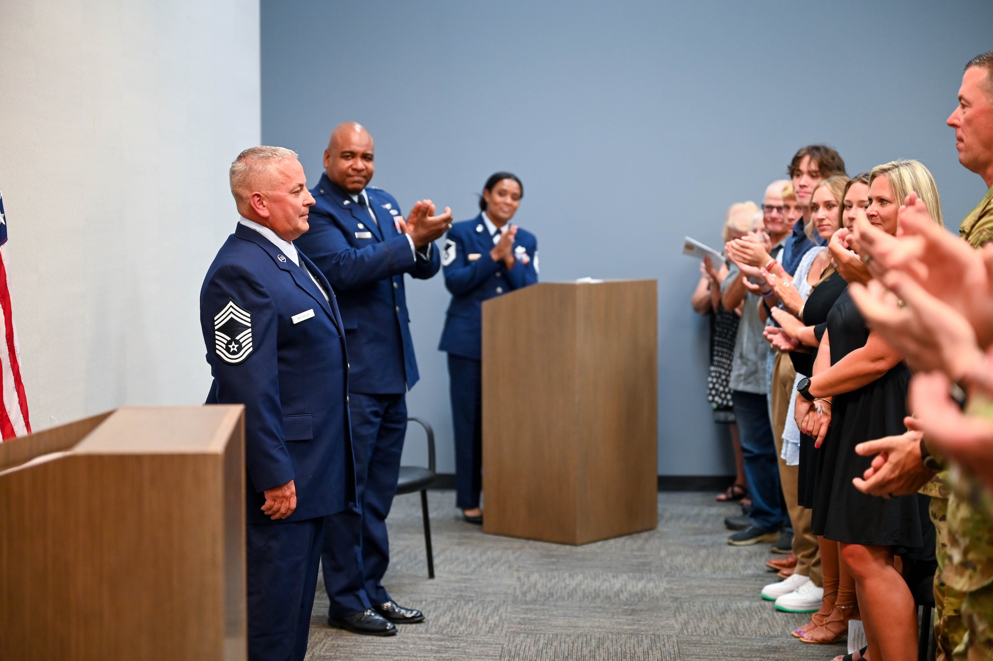 Chief Master Sgt. Kevin D. Brannan receives a standing ovation from the audience during the promotion ceremony on Aug. 3, 2024 at Naval Air Station Joint Reserve Base Fort Worth, Texas. Brannan serves as an air reserve technician and aerial port manager for the 73rd Aerial Port Squadron.
