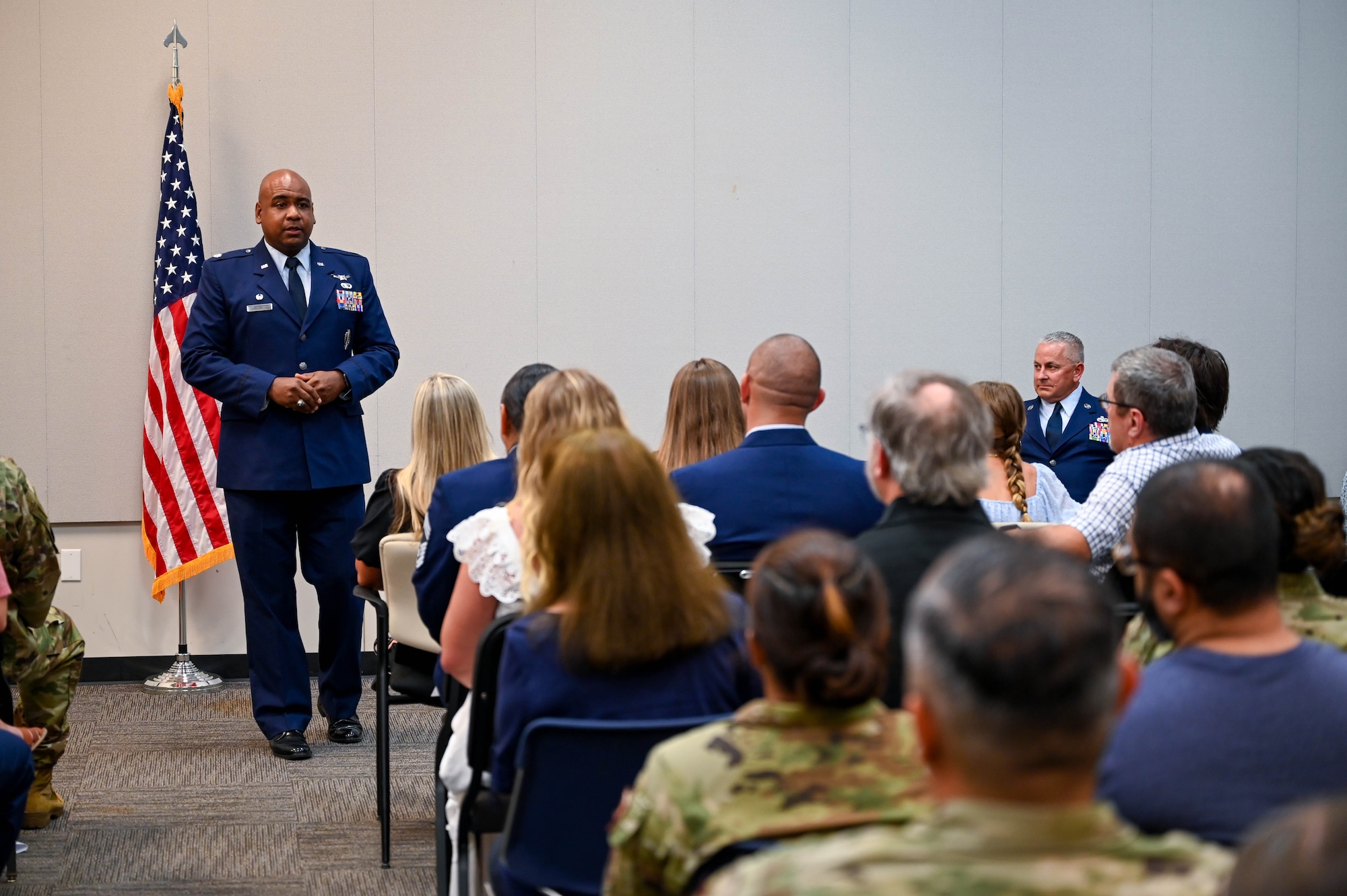 Presiding officer and 73rd Aerial Port Squadron commander, Colonel Rodney Ellison, Jr., shares thoughtful words with the audience about Chief Master Sergeant Kevin D. Brannan during the promotion ceremony on August 3, 2024 at U.S. Naval Air Station Joint Reserve Base Fort Worth, Texas. Brannan serves as the Senior Air Reserve Technician and Aerial Port Manager for the 73rd APS.