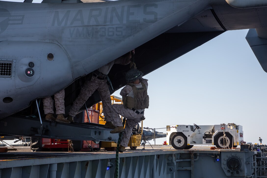 A U.S. Marine with the 24th Marine Expeditionary Unit (MEU) Special Operations Capable (SOC) fast ropes from a static MV-22B Osprey tiltrotor aircraft aboard the amphibious assault ship USS Wasp (LHD 1) while underway in the Mediterranean Sea, July 29, 2024. The Wasp (WSP) Amphibious Ready Group and embarked 24th MEU (SOC) are conducting operations in the U.S. Naval Forces Europe and Africa area of operations on a scheduled deployment. The WSP ARG-24th MEU (SOC) is supporting U.S., Allied and partner interests in the region, including in the Eastern Mediterranean Sea, to continue promoting regional stability and deterring aggression. (U.S. Marine Corps photo by Cpl. Aydan Millette)