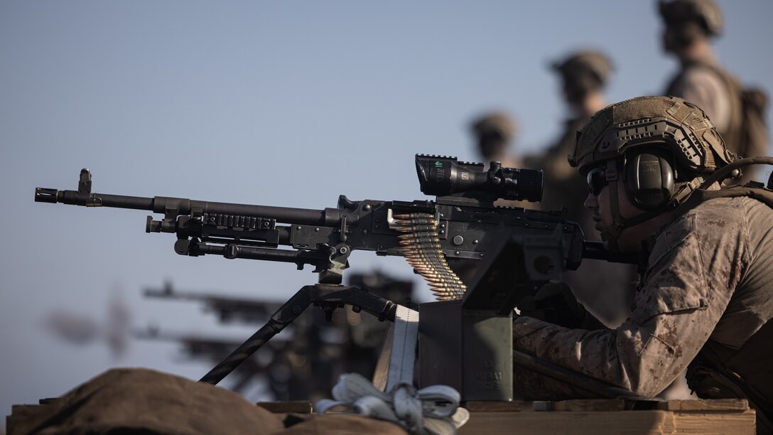 U.S. Marines with Battalion Landing Team 1/8, 24th Marine Expeditionary Unit (MEU) Special Operations Capable (SOC), fire M240B machine guns during a crew-served weapons deck shoot aboard the San Antonio-class amphibious transport dock ship USS New York (LPD 21) while underway in the Mediterranean Sea, July 28, 2024. The Wasp (WSP) Amphibious Ready Group and embarked 24th MEU (SOC) are conducting operations in the U.S. Naval Forces Europe and Africa area of operations on a scheduled deployment. The WSP ARG-24th MEU (SOC) is supporting U.S., Allied and partner interests in the region, including in the Eastern Mediterranean Sea, to continue promoting regional stability and deterring aggression. (U.S. Marine Corps photo by Cpl. Ryan Ramsammy)