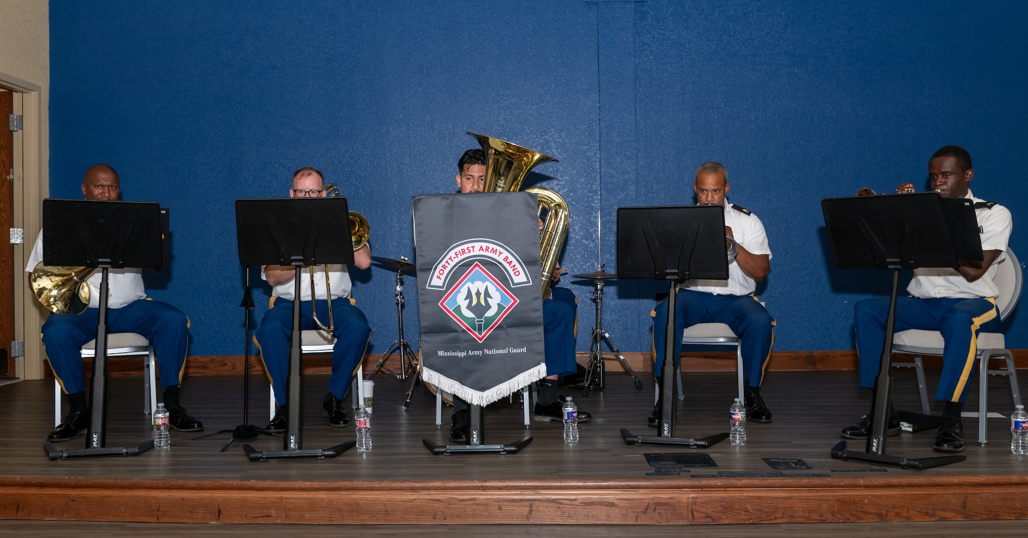 The Mississippi Army National Guard, 41st Army Band, plays music during the Second Air Force change of command ceremony inside the Bay Breeze Event Center at Keesler Air Force Base, Mississippi, Aug 2, 2024.