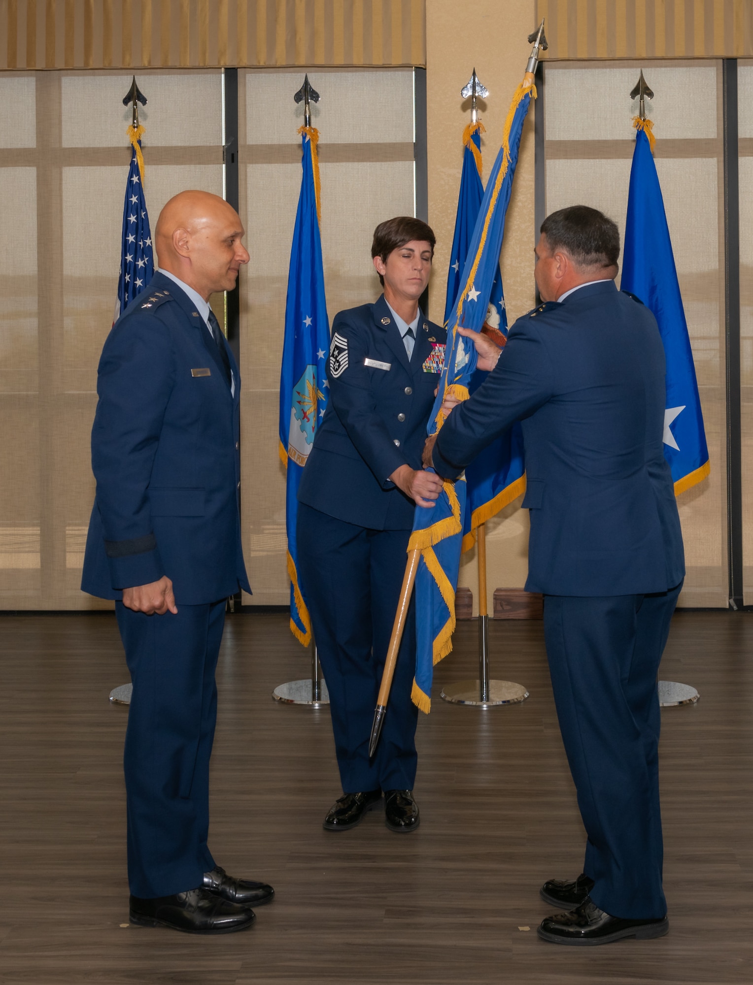 U.S. Air Force Lt. Gen. Brian Robinson, Air Education and Training Command commander, returns a salute to Maj. Gen. Matthew Davidson, Second Air Force commander, during the Second Air Force change of command ceremony inside the Bay Breeze Event Center at Keesler Air Force Base, Mississippi, Aug 2, 2024.