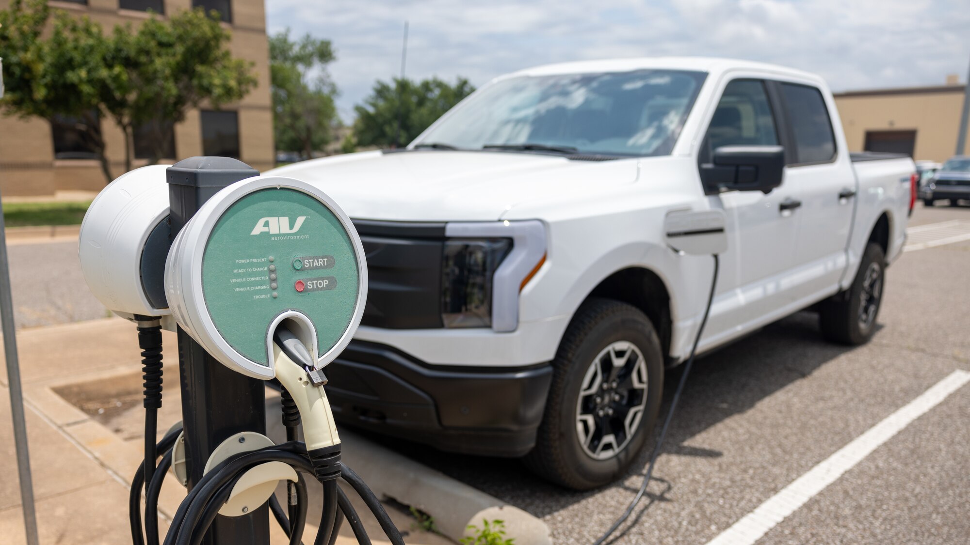 electric truck in front of charger