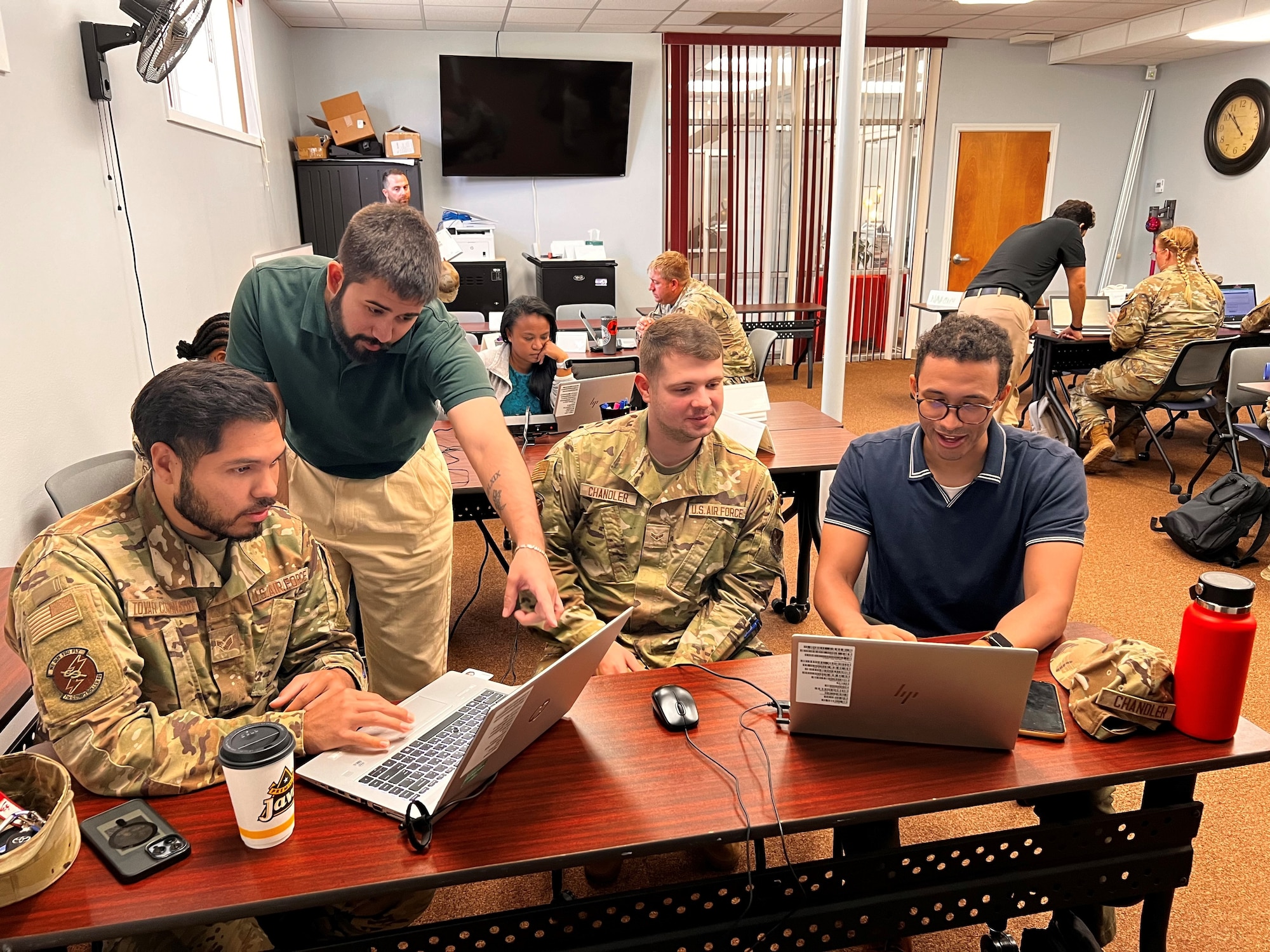 Dyess Airmen participate in the Air Force Robotics Process Automation Roadshow in the Military and Family Readiness Center on Dyess Air Force Base, Texas, Aug. 1, 2024. The roadshow was created to allow members to begin the course with little to no knowledge of UiPath  with students coming up with multiple ideas at the end of the week to help implement RPA into their units. (U.S. Air Force photo by Staff Sgt. Katora Millsaps)
