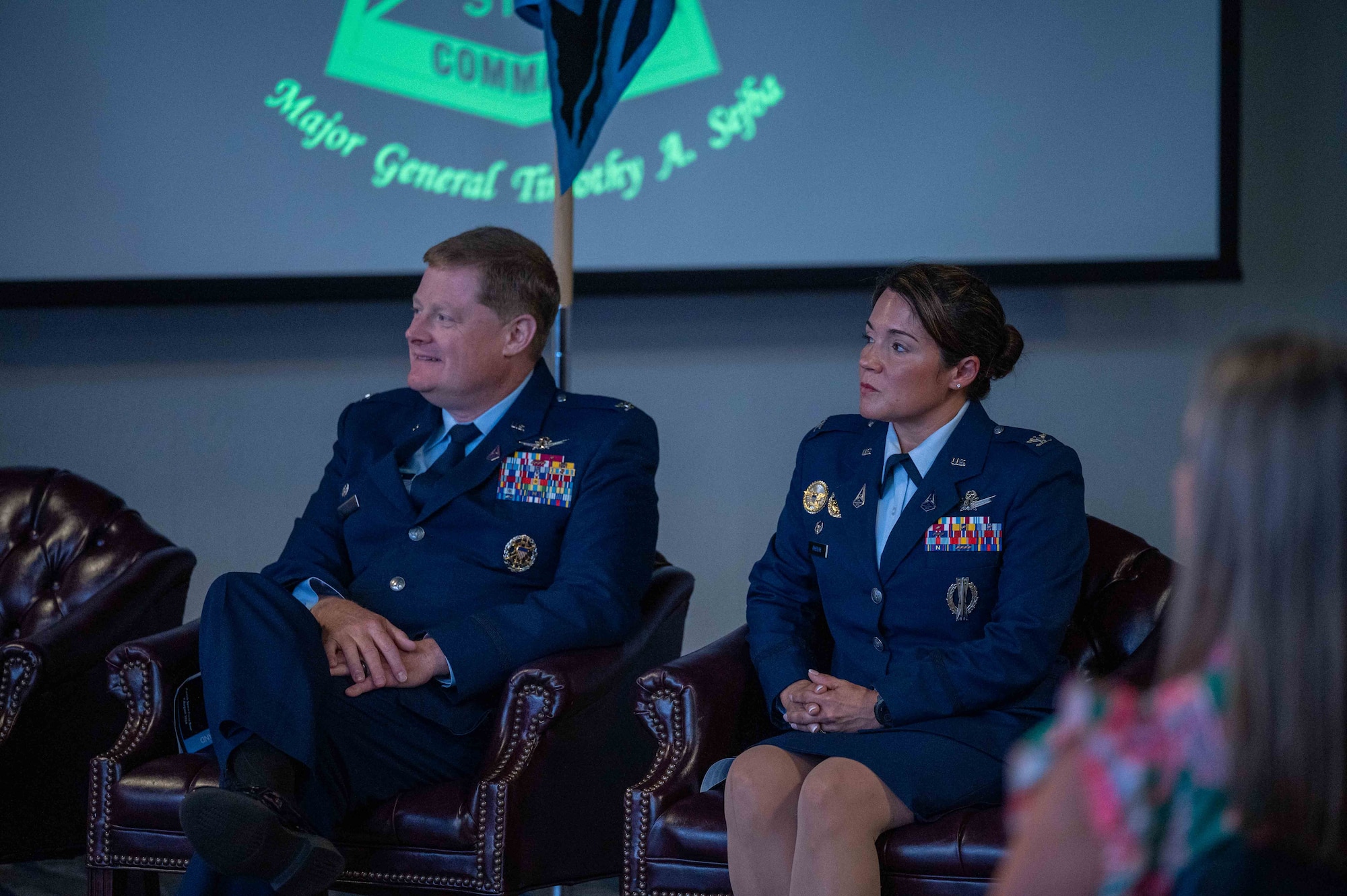 U.S. Space Force Col. Jack D. Fulmer II, outgoing Space Delta 10 commander, left, and Col. Shannon DaSilva, incoming Delta 10 commander, listen to remarks during the Delta 10 change of command ceremony at Patrick Space Force Base, Florida, Aug. 7, 2024.