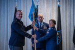 U.S. Space Force Maj. Gen. Timothy A. Sejba, Space Training and Readiness Command commander, passes the guidon to Col. Shannon DaSilva, incoming Space Delta 10 commander, during the Delta 10 change of command ceremony at Patrick Space Force Base, Florida, Aug. 7, 2024.