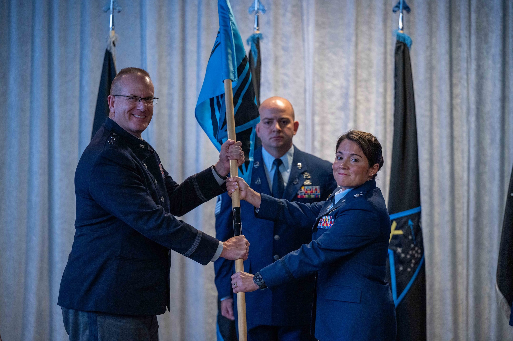 U.S. Space Force Maj. Gen. Timothy A. Sejba, Space Training and Readiness Command commander, passes the guidon to Col. Shannon DaSilva, incoming Space Delta 10 commander, during the Delta 10 change of command ceremony at Patrick Space Force Base, Florida, Aug. 7, 2024.