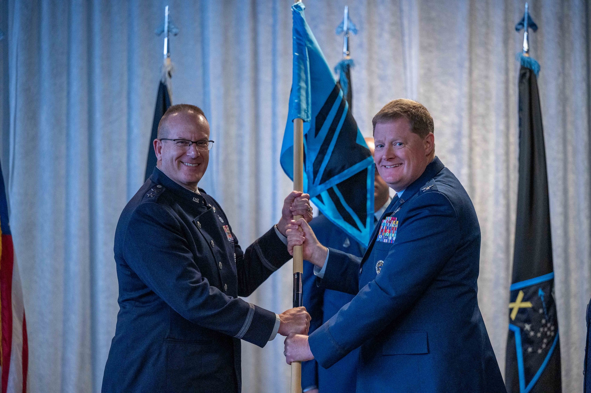 U.S. Space Force Maj. Gen. Timothy A. Sejba, Space Training and Readiness Command commander, receives the guidon from Col. Jack D. Fulmer II, outgoing Space Delta 10 commander, during the Delta 10 change of command ceremony at Patrick Space Force Base, Florida, Aug. 7, 2024.
