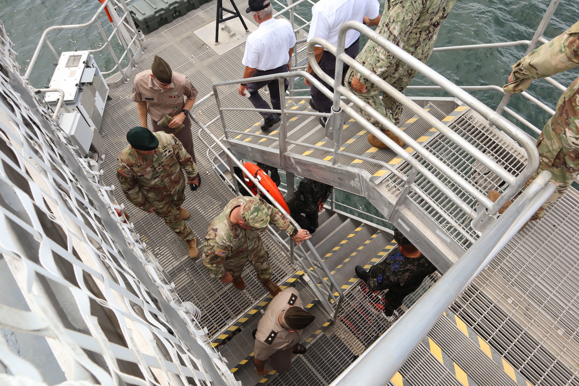 A photo of people walking down stairs.