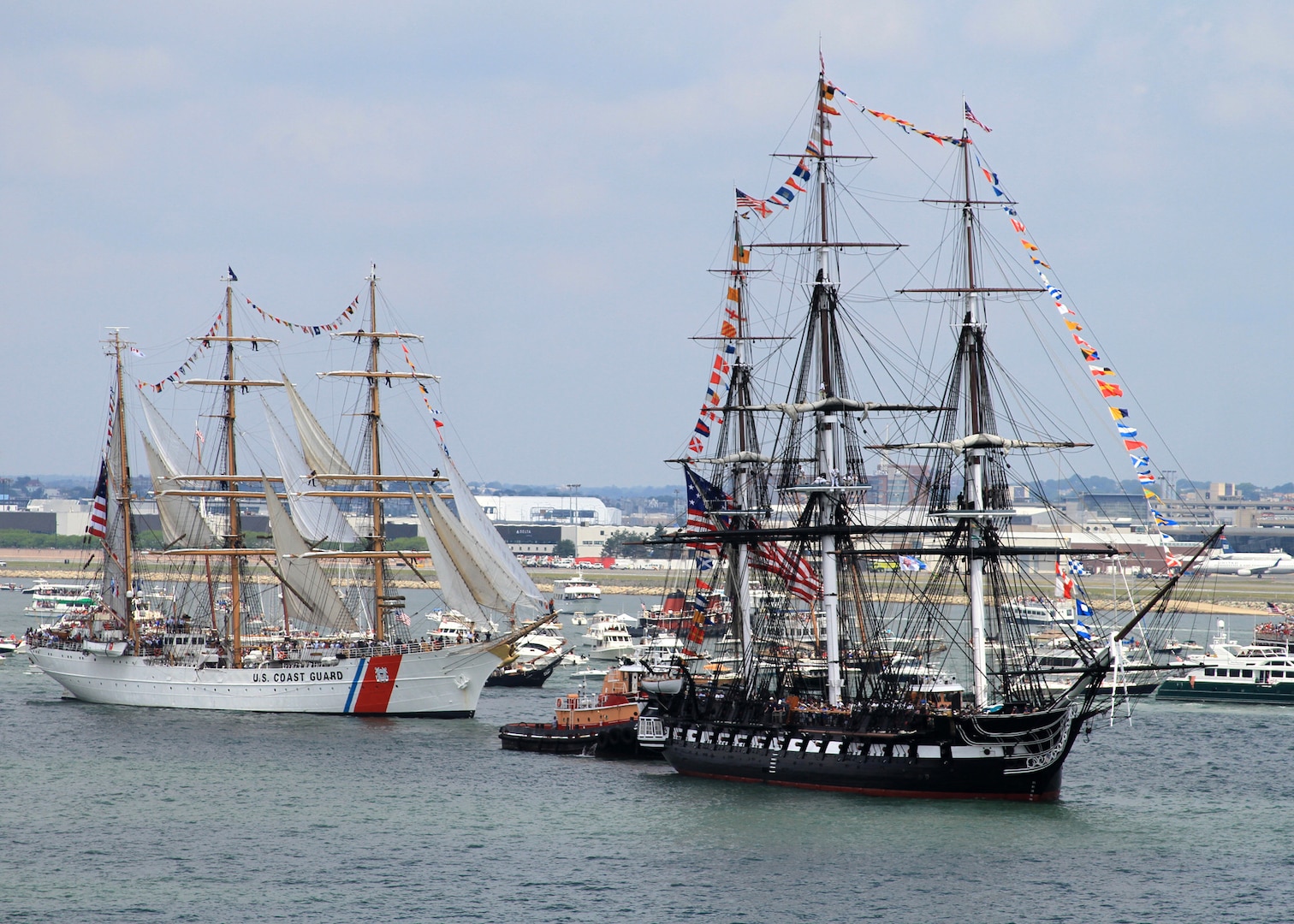 The U.S. Coast Guard Cutter Eagle (WIX 327) passes USS Constitution in Boston Harbor during the ship's July Fourth turnaround cruise as part of Boston Navy Week. Boston Navy Week is one of 15 signature events planned across America in 2012. The eight-day event commemorates the bicentennial of the War of 1812, hosting service members from the U.S. Navy, Marine Corps and Coast Guard and coalition ships from around the world.