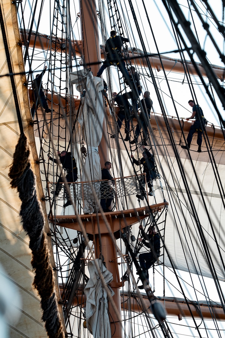 Coast Guard Academy Cadets climb the rigging of Coast Guard Cutter Eagle (WIX 327) while underway July, 30, 2024. The Eagle serves as a classroom at sea for Academy Cadets and future leaders in the Coast Guard.