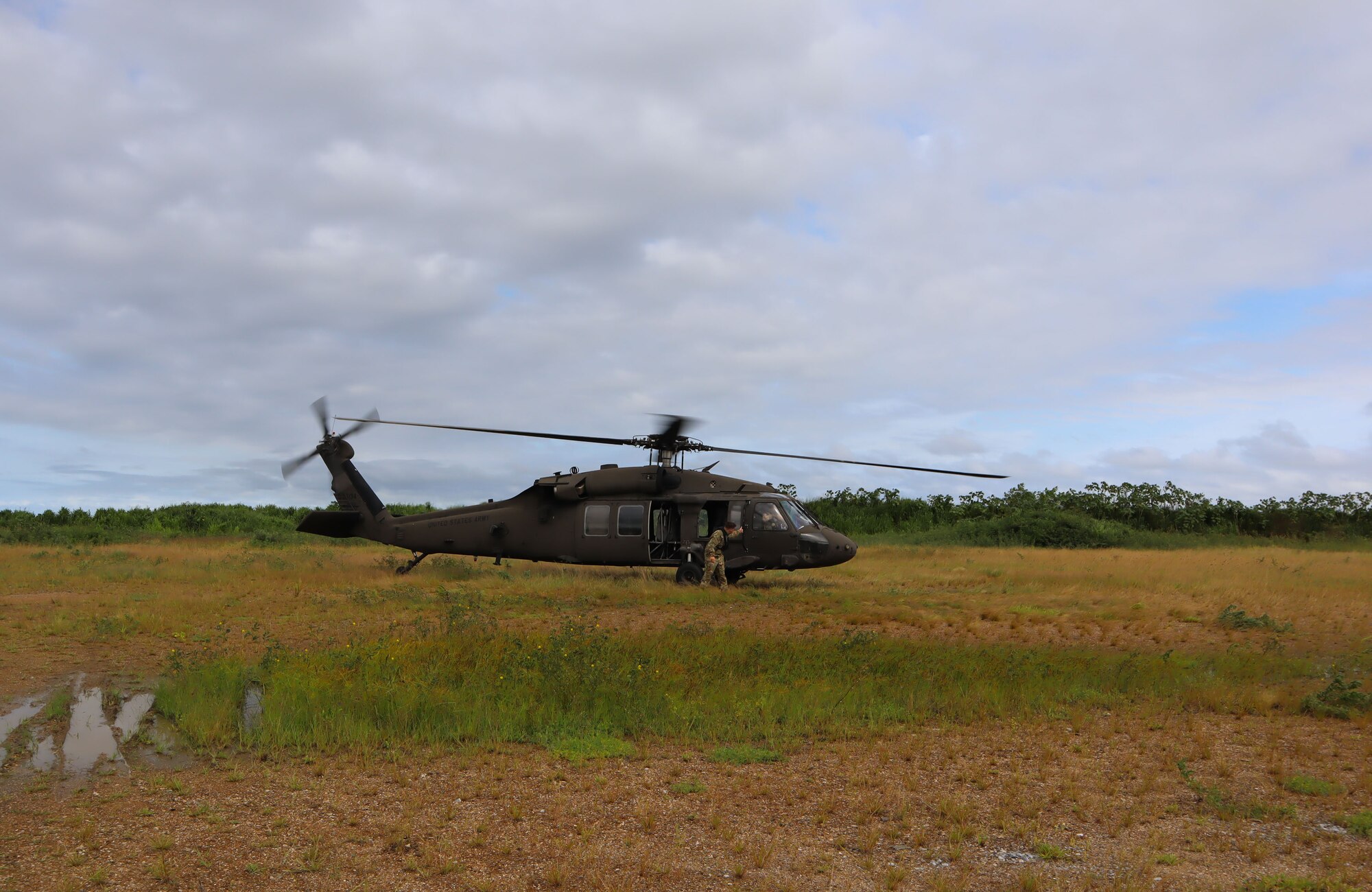 A photo of a helicopter in a field.