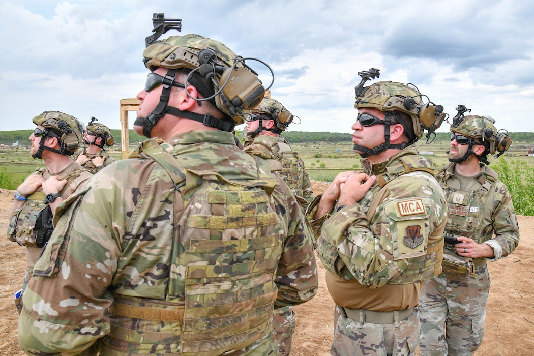 Members of the 127th Maintenance Group’s agile combat employment team, Michigan Air National Guard, observe A-10 Thunderbolt II aircraft practice airstrikes