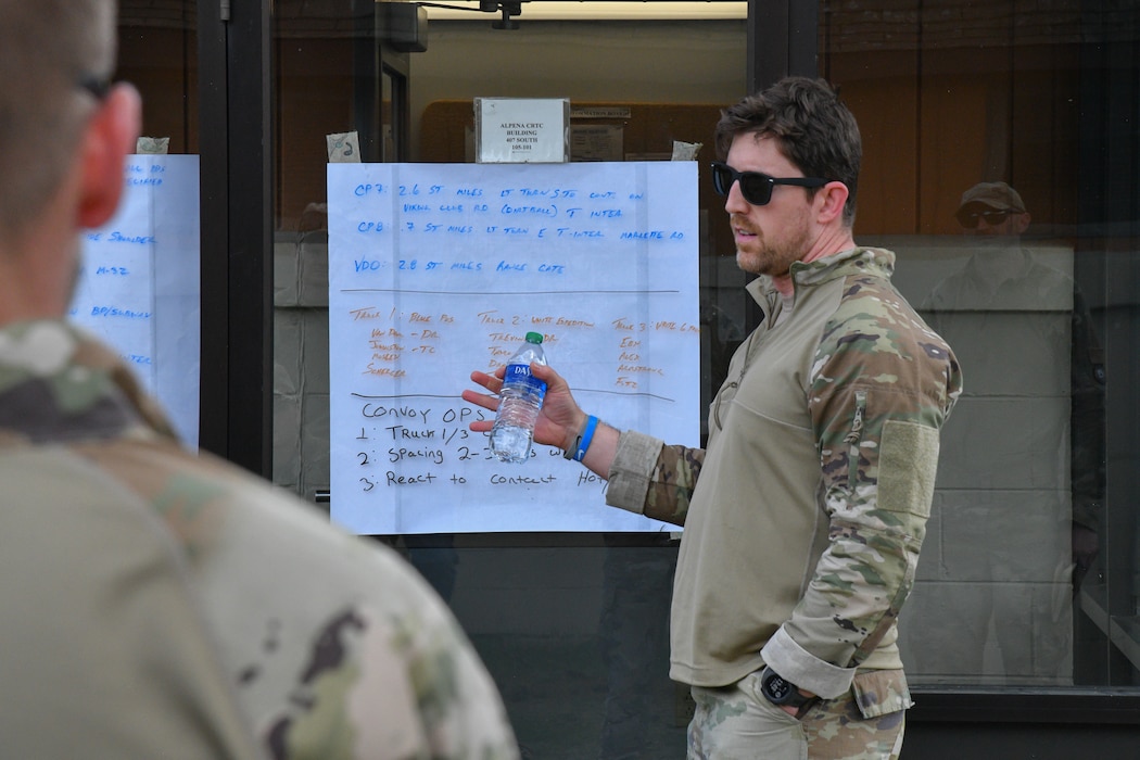 U.S. Air Force Tech. Sgt. Teddy Johnston, an A-10 Thunderbolt II crew chief and member of the 127th Maintenance Group's agile combat employment team, Michigan Air National Guard, practices giving a convoy brief in Alpena, Michigan, May 20, 2024. The ACE team worked with tactical air control party specialists assigned the 284th Air Support Operations Squadron at the Alpena Combat Readiness Training Center to augment fieldcraft training requirements for launching A-10s from austere and contingency locations.