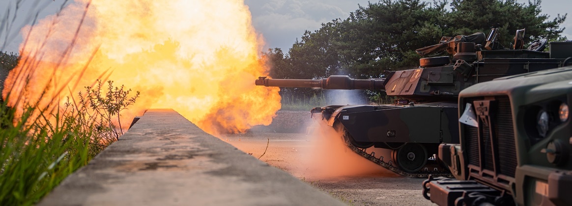 An M1A2 SEP v2 Abrams assigned to Bravo Company, 4th Battalion, 70th Armored Regiment, 1st Armored Brigade Combat Team, 1st Armored Division, fires at a target during a zero range at Rodriguez Live-Fire Complex, South Korea, Aug. 5, 2024.
