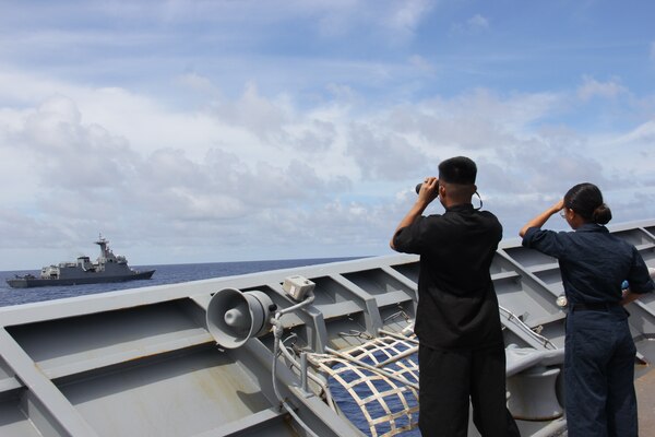 SOUTH CHINA SEA (August 7, 2024) U.S. Navy Sailors assigned to the Ticonderoga-class guided-missile cruiser USS Lake Erie (CG 70), observe the Philippine Navy’s Jose Rizal-class frigate BRP Jose Rizal (FF 150), during a quadrilateral Maritime Cooperation Activity exercise with the Australia, Canada, the Philippines and the U.S., Aug. 7, 2024, Aug. 7, 2024. Lake Erie is assigned to Destroyer Squadron (DESRON) 15, the Navy’s largest DESRON and the U.S. 7th Fleet’s principal surface force. 7th Fleet is the U.S. Navy’s largest forward-deployed numbered fleet, and routinely interacts and operates with allies and partners in preserving a free and open Indo-Pacific region. (U.S. Navy photo by Lt. j.g. Selena Esteban)