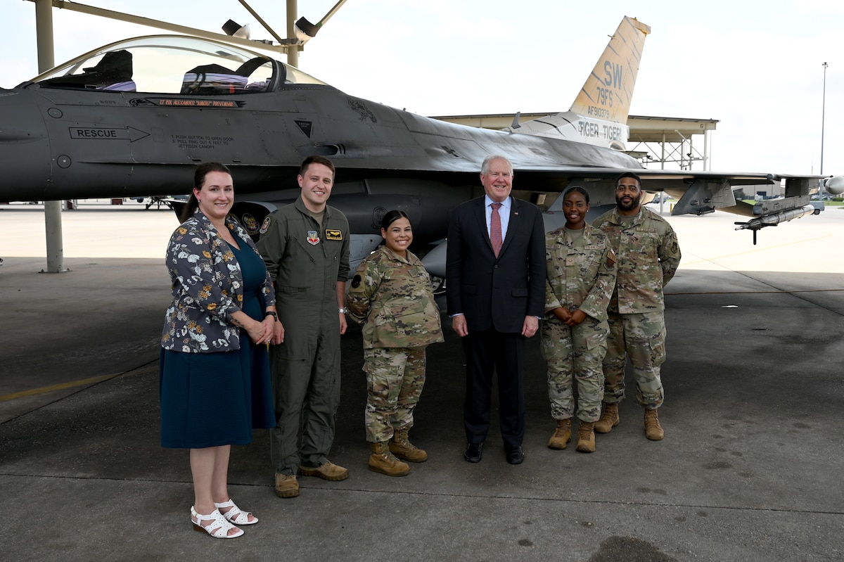 Secretary of the Air Force Frank Kendall, center, stands for a photo with Team Shaw superior performers during a visit to Shaw Air Force Base, S.C., July 30, 2024. Kendall spoke with each of the members to learn of their unique contributions to Shaw AFB’s varied units missions. (U.S. Air Force photo by Staff Sgt. Kelsey Owen)