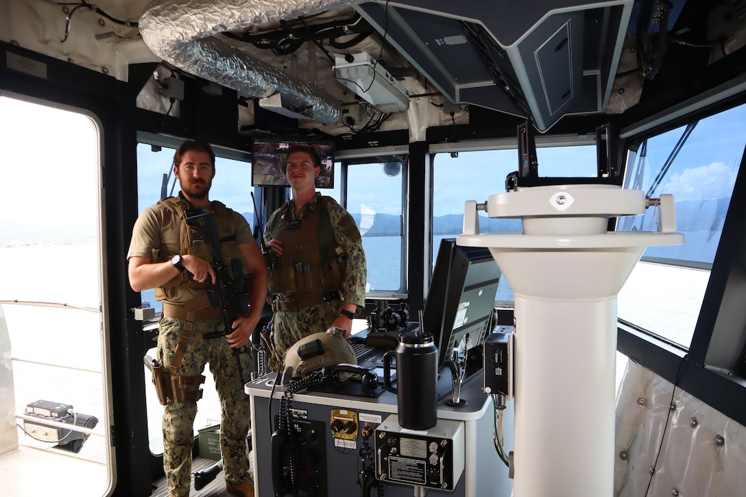 A photo of two Sailors posing for a photo.