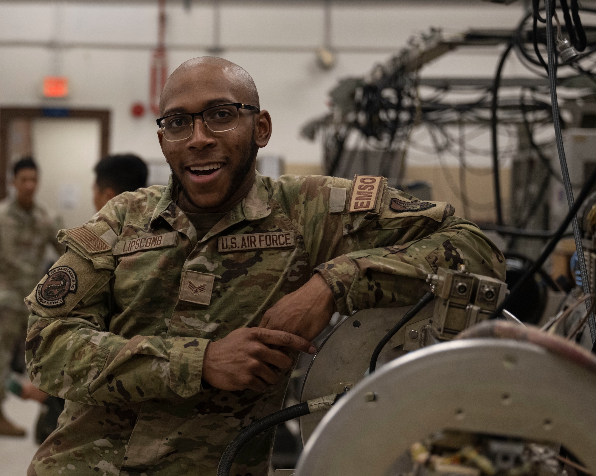 Senior Airman Myles Lipscomb, 8th Maintenance Squadron electromagnetic systems journeyman, stands with an ALQ-184 electronic countermeasure pod assembly at Kunsan Air Base, Republic of Korea, August 5, 2024