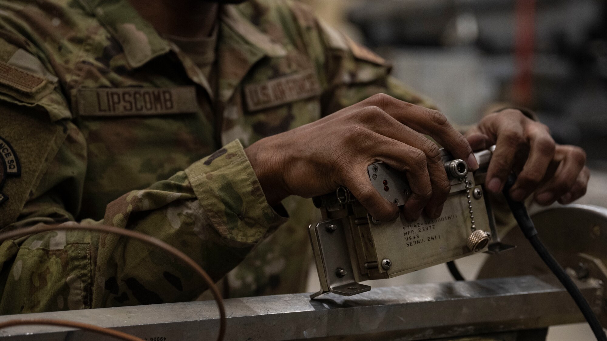 Senior Airman Myles Lipscomb, 8th Maintenance Squadron electromagnetic systems journeyman installs components on an ALQ-184 electronic countermeasure pod assembly at Kunsan Air Base, Republic of Korea.