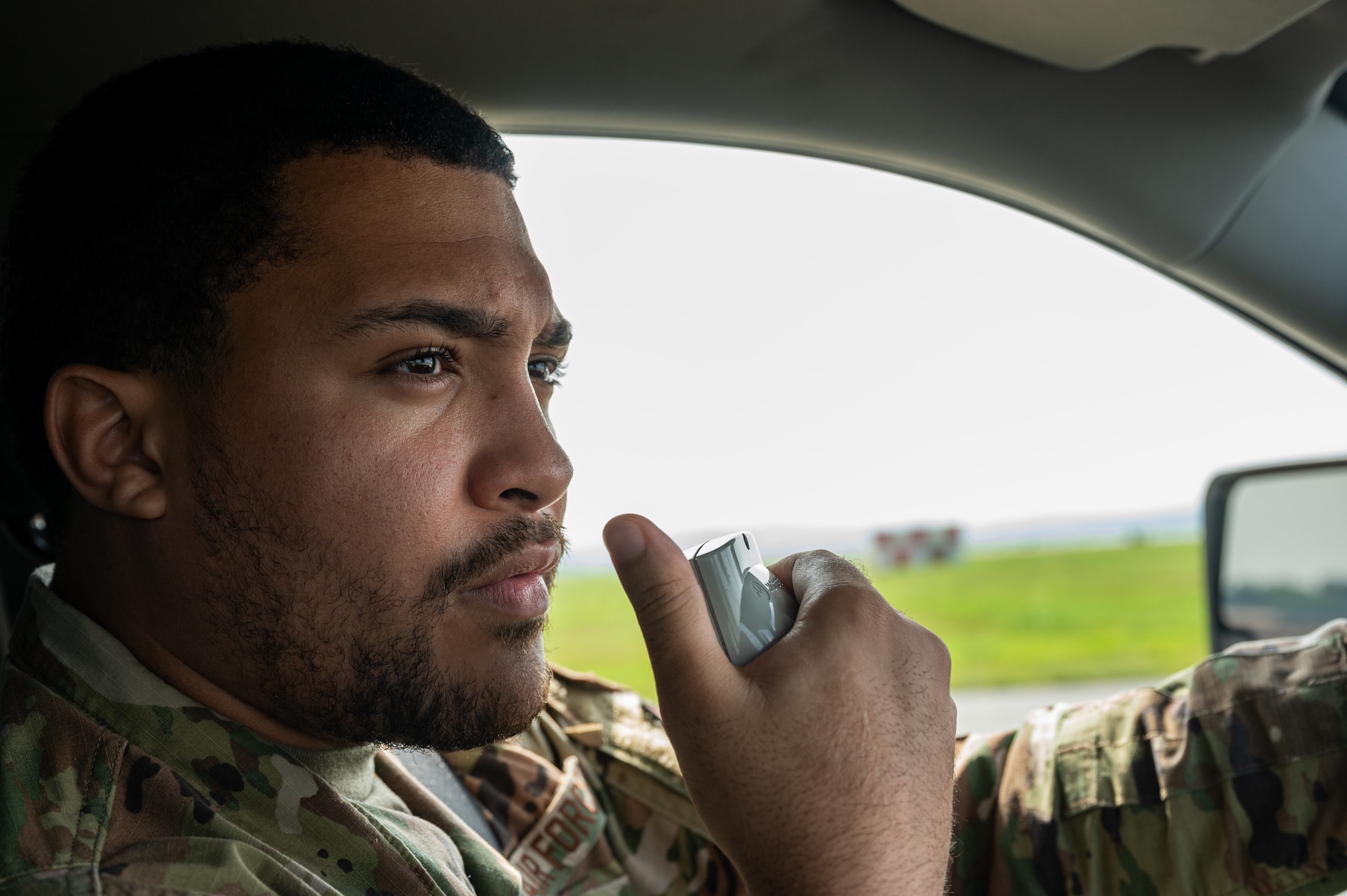 U.S. Air Force Senior Airman Shawn Yarborough, 51st Operational Support Squadron airfield management operations supervisor, requests permission to initiate a foreign object debris check on a runway at Osan Air Base, Republic of Korea, Aug. 6, 2024. The 51st OSS Airfield Management Flight is responsible for maintaining safe, secure and efficient airfield environments to ensure aircraft can takeoff or land at a moment’s notice. Yarborough has excelled in his career field and was recognized for his contributions to the “Fight Tonight” mission. (U.S. Air Force photo by Airman 1st Class Chase Verzaal)