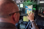 U.S. Air Force Master Sgt. Jason Stoos, a boom operator with the185th Air Refueling Wing, Sioux City, Iowa, trains to operate the Real Time Information in the Cockpit system on the KC-135R Stratotanker aircraft during Exercise Northern Strike 24-2 at Alpena Combat Readiness Training Center, Michigan, Aug 5, 2024.