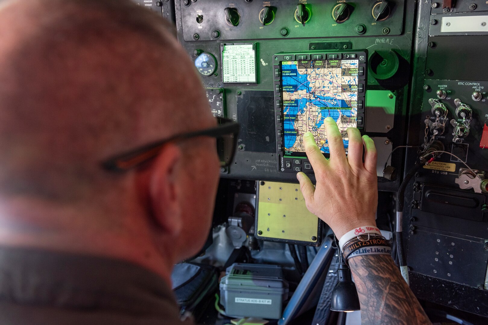 U.S. Air Force Master Sgt. Jason Stoos, a boom operator with the185th Air Refueling Wing, Sioux City, Iowa, trains to operate the Real Time Information in the Cockpit system on the KC-135R Stratotanker aircraft during Exercise Northern Strike 24-2 at Alpena Combat Readiness Training Center, Michigan, Aug 5, 2024.