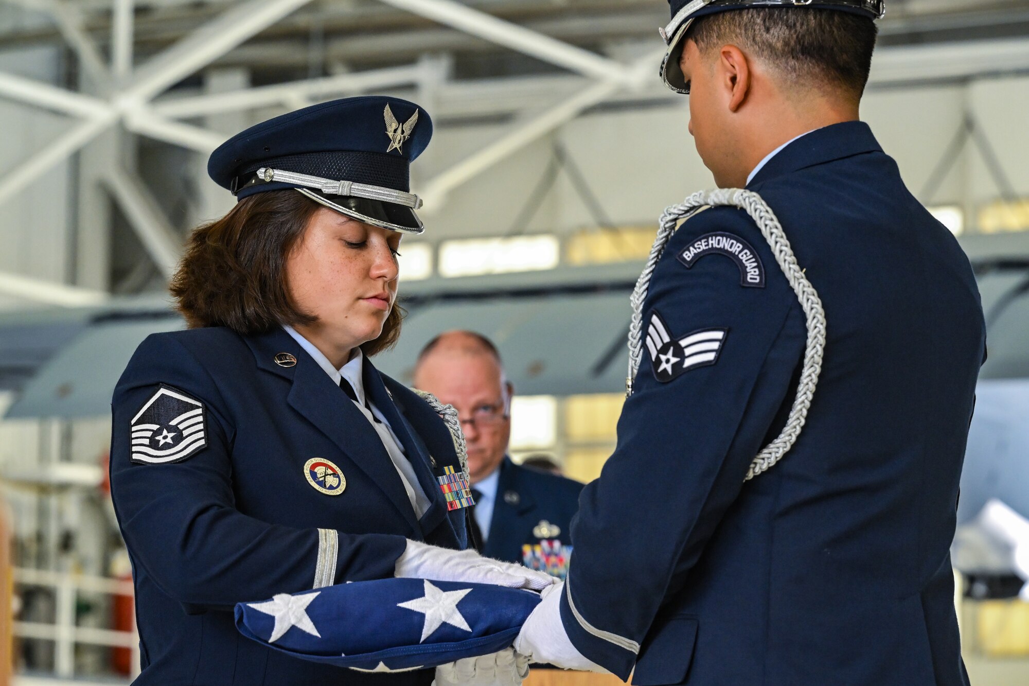 The 910th Airlift Wing Base Honor Guard folds an American flag during the retirement ceremony for Chief Master Sgt. Jennifer McKendree, 910th AW command chief, at Youngstown Air Reserve Station, Ohio, Aug. 3, 2024.