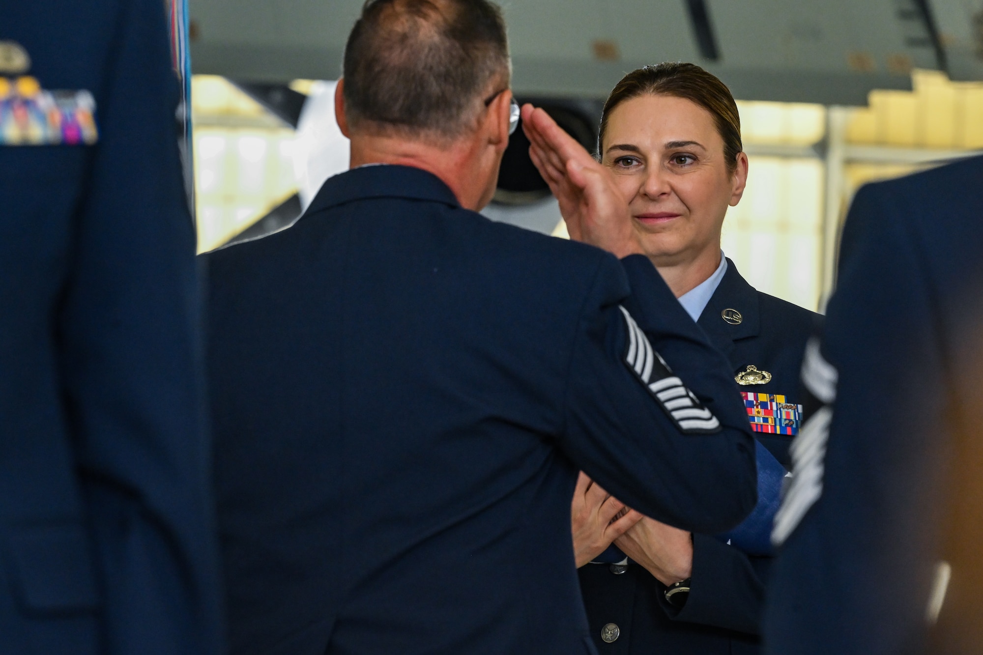 Chief Master Sgt. Jennifer McKendree, 910th Airlift Wing command chief, receives an American flag during her retirement ceremony at Youngstown Air Reserve Station, Ohio, Aug. 3, 2024.