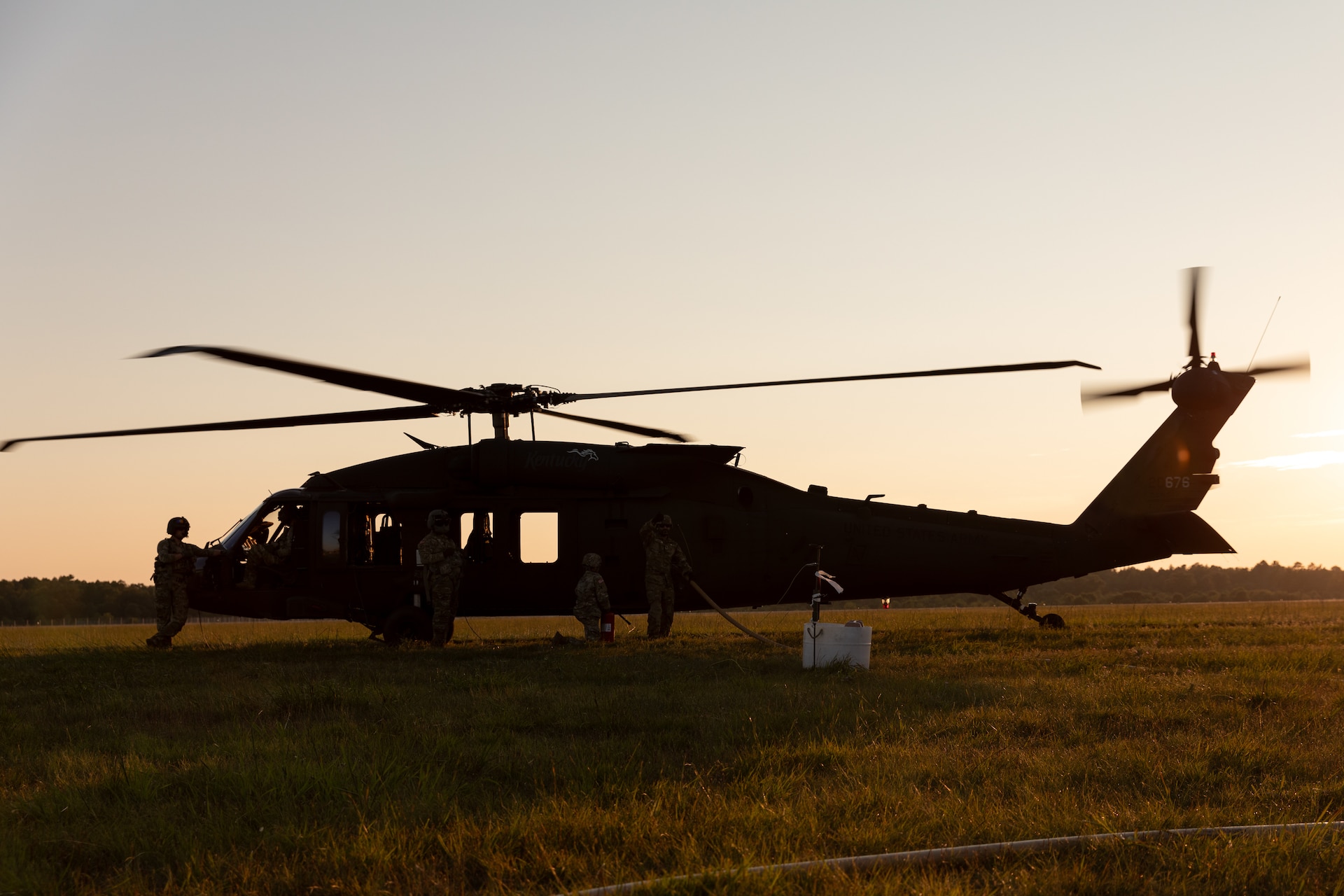 Soldiers with Echo Company 2/147th Assault Helicopter Battalion, 63rd Theater Aviation Brigade conduct a UH-60 Blackhawk "hot fuel" at Camp Grayling Army Airfield in Grayling, Michigan on July 16, 2024. Soldiers with Bravo Company conducted aerial gunnery at Camp Grayling for their annual training. (U.S. Army National Guard photo by Sgt. 1st Class Andrew Dickson)