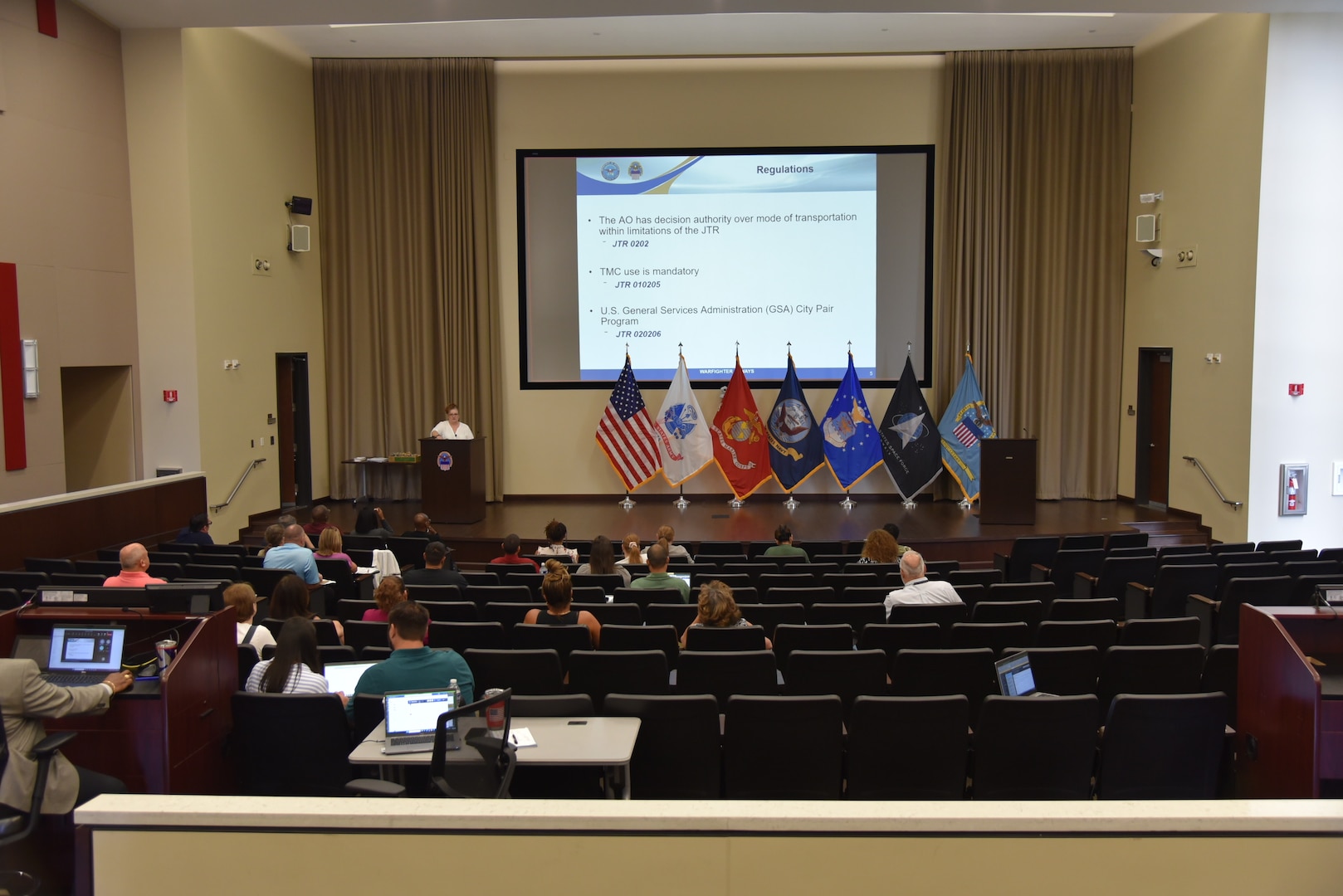 People gathered in an auditorium.