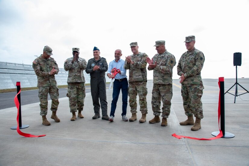 Service members pose for a photo.
