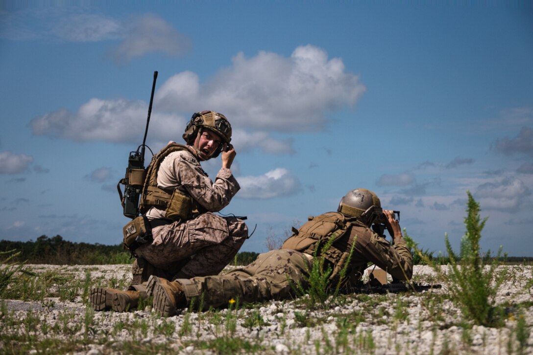 U.S. Marine Corps Capt. Trevor Ellingson, a forward air controller with 2nd Air Naval Gunfire Liaison Company, II Marine Expeditionary Force Information Group, and a soldier from United Arab Emirates Presidential Guard Joint Fires Command conduct close air support as part of Unit Enhancement Training 24-2 at Marine Corps Base Camp Lejeune, North Carolina, July 18, 2024. UET 24-2 is a bilateral military exercise held to strengthen interoperability and build upon the longstanding military relationship between U.S. Marines and the United Arab Emirates soldiers. (U.S. Marine Corps photo by Cpl. Maurion Moore)