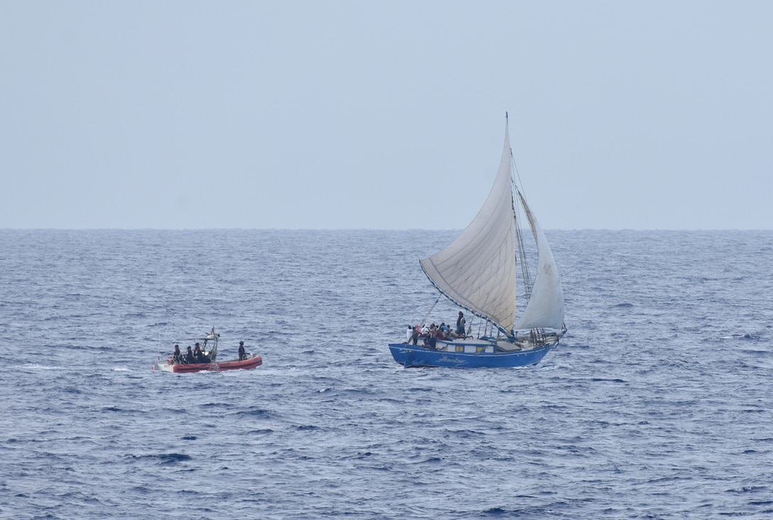 A Coast Guard Cutter Venturous small boat crew arrives alongside a Haitian sailing vessel to investigate a potential migrant venture off the coast of Haiti on July 29, 2024.  Venturous’ crew conducted a 60-day maritime safety and security patrol in the Windward Passage and Florida Straits. (U.S. Coast Guard photo by Ensign Dev Craig)