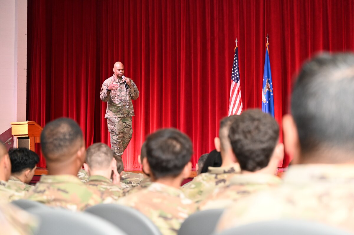 Chief Master Sgt. Travon Dennis, 4th Air Force command chief, speaks to Reserve Citizen Airmen of the 433rd Airlift Wing during an enlisted call at Joint Base San Antonio-Lackland, Texas, Aug. 4, 2024.
