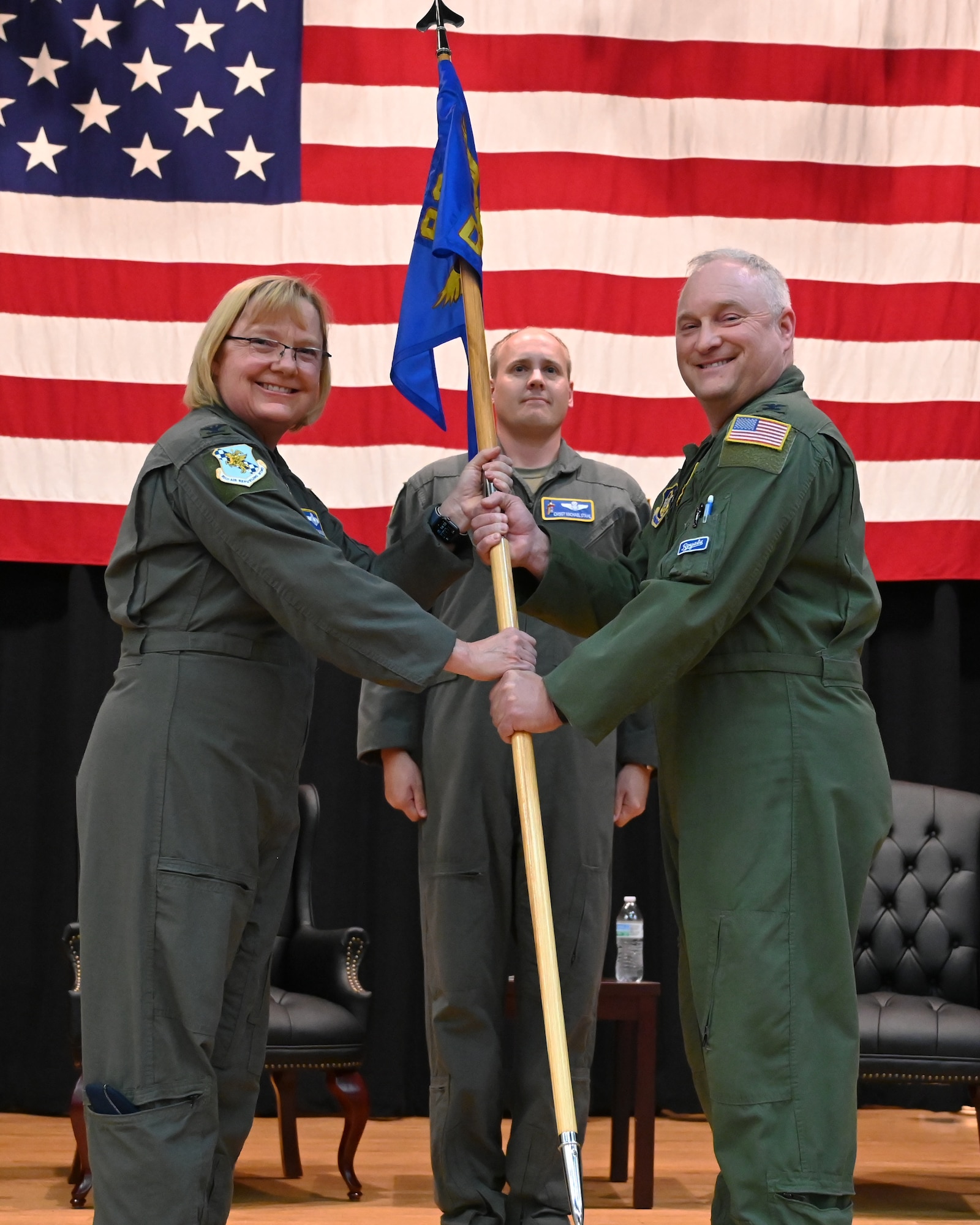 (Left to right) Col. Cynthia Welch, 931st Air Refueling Wing commander, hands the guidon to Col. Matt Basler, incoming 931st Operations Group commander. Basler had previously commanded the 931st Mission Support Group since 2019