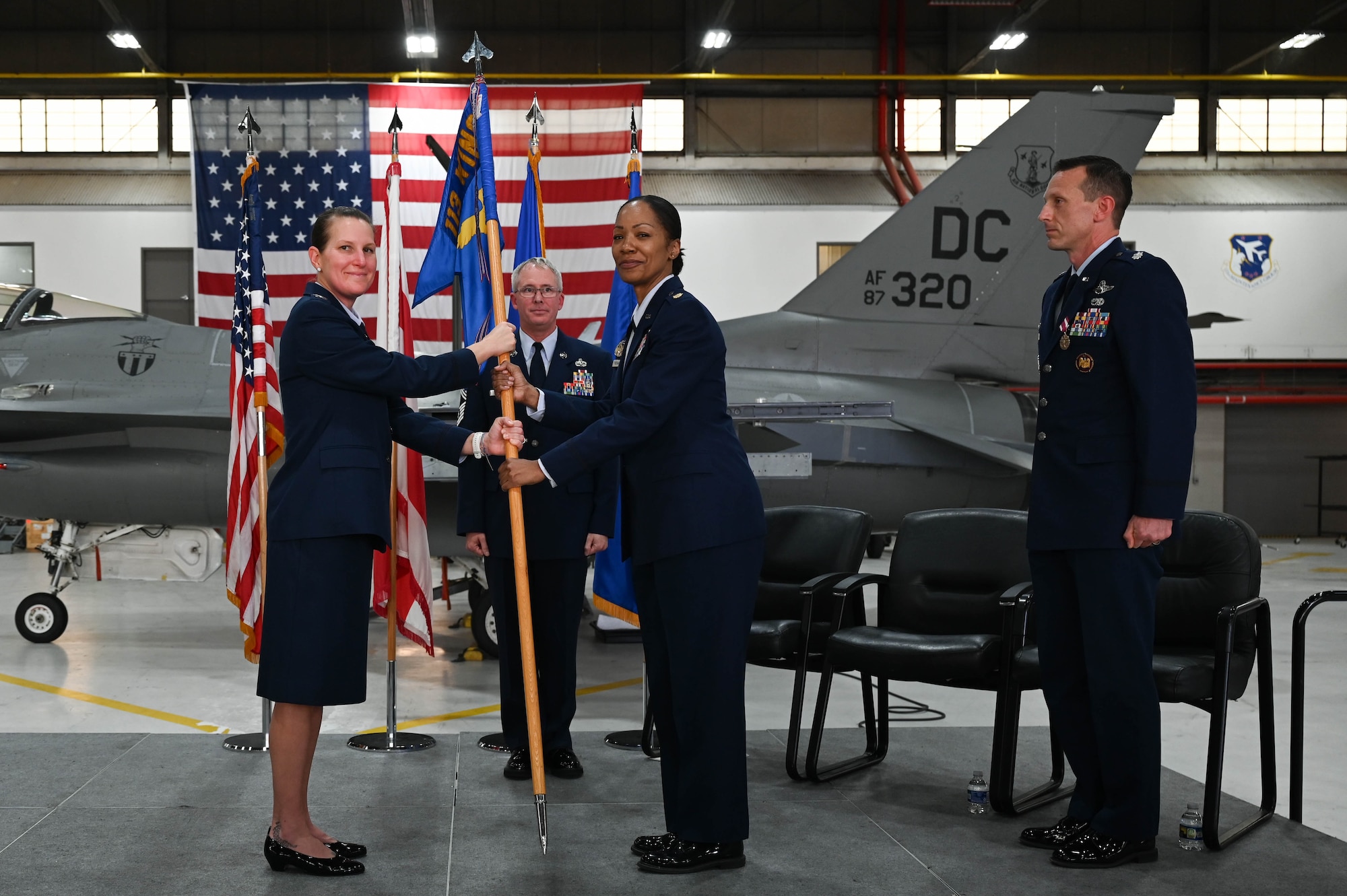 U.S. Air Force Maj. Latausha Freeman, center right, incoming commander, 113th Aircraft Maintenance Squadron, District of Columbia Air National Guard, assumes command of the 113th AMXS