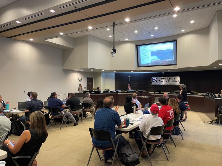Right, Eileen Takata, U.S. Army Corps of Engineers South Pacific Division environmental manager, introduces an exercise scenario during the Carbon Canyon Dam tabletop exercise July 31, 2024, at the Yorba Linda Water District in Placentia, California.
