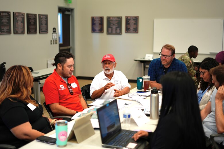 Third from left, Louie Muñoz, U.S. Army Corps of Engineers Los Angeles District emergency management specialist, discusses an exercise scenario with participants during the Carbon Canyon Dam tabletop exercise July 31, 2024, at the Yorba Linda Water District in Placentia, California.