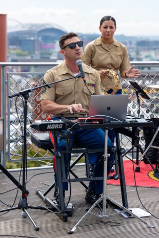 U.S. Marine Corps Gunnery Sgt. Kevin Ashley, a pianist with 1st Marine Division Band, gives a public performance as part of Seattle Fleet Week 2024 at Pike Place Market in Seattle, July 31, 2024. During fleet week, service members participate in various community service events, showcase capabilities and equipment to the community, and enjoy the hospitality of Seattle and its surrounding areas. (U.S. Marine Corps photo by Staff Sgt. Courtney G. White)