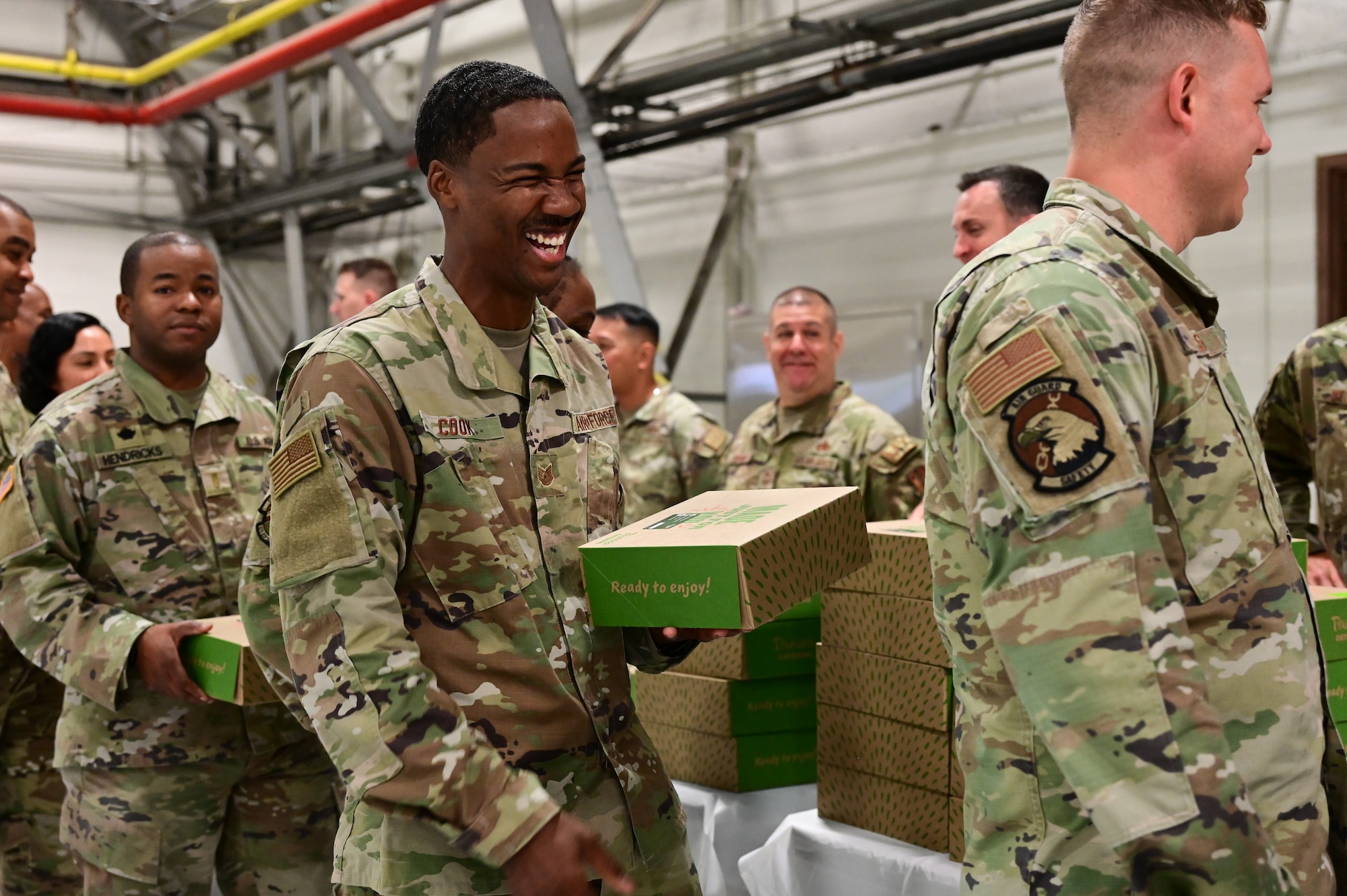 Members of the District of Columbia National Guard pick up breakfast meals during the Annual National Guard Joint Prayer Breakfast held on June 9, 2024, at Joint Base Andrews, Md