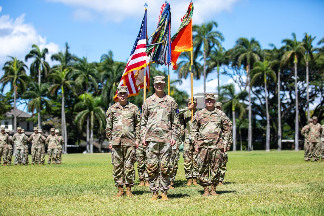 Brig. Gen Ray Phariss, Lt. Gen. James B. Jarrard and Brig. Gen. Kevin Meisler march during 311th Signal Command (Theater) change of command ceremony at historic Palm Circle in Fort Shafter on July 19, 2024.